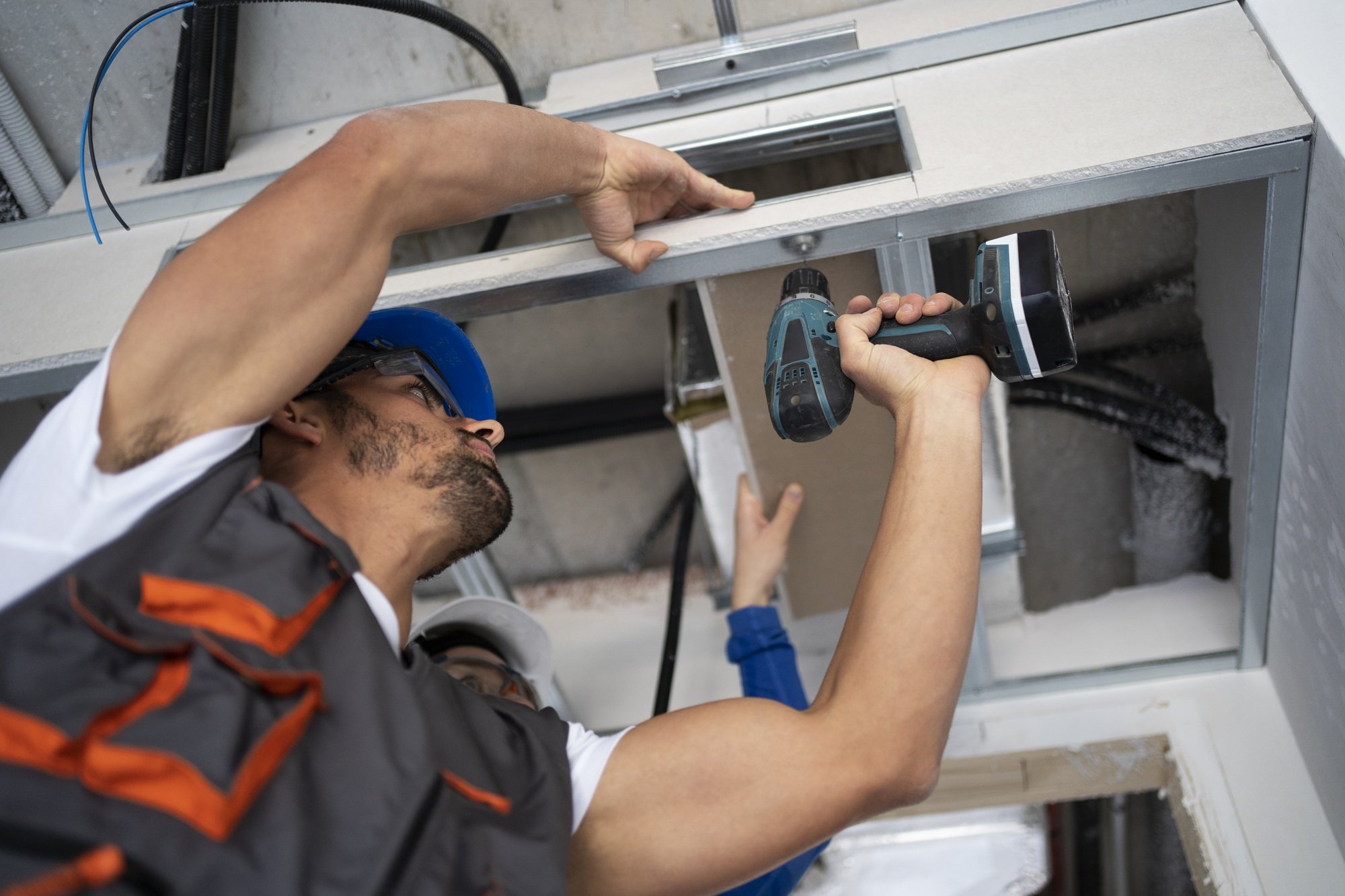 low-angle-people-working-with-drill_23-2149366670 (1)